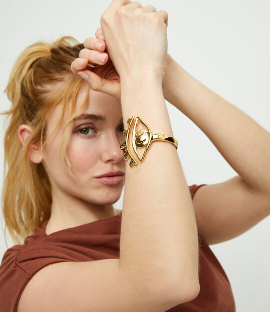 Bangle bracelet with a striking central eye
