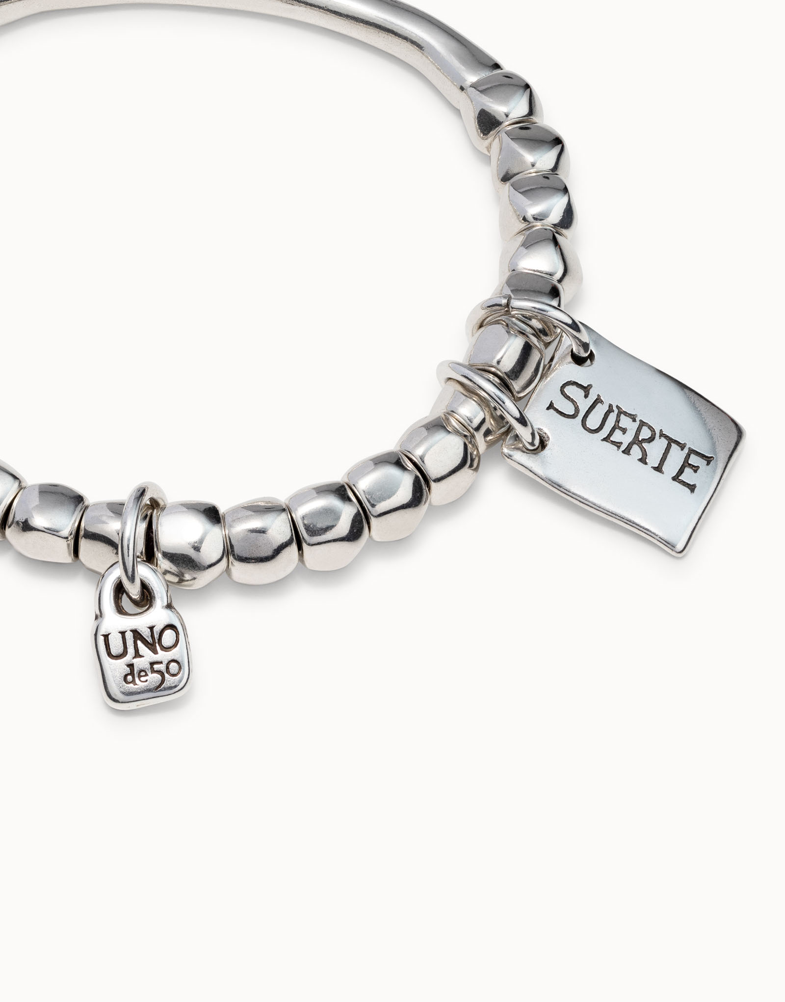 Beaded stretch bracelet with tubular piece and a charm, , large thumbnail