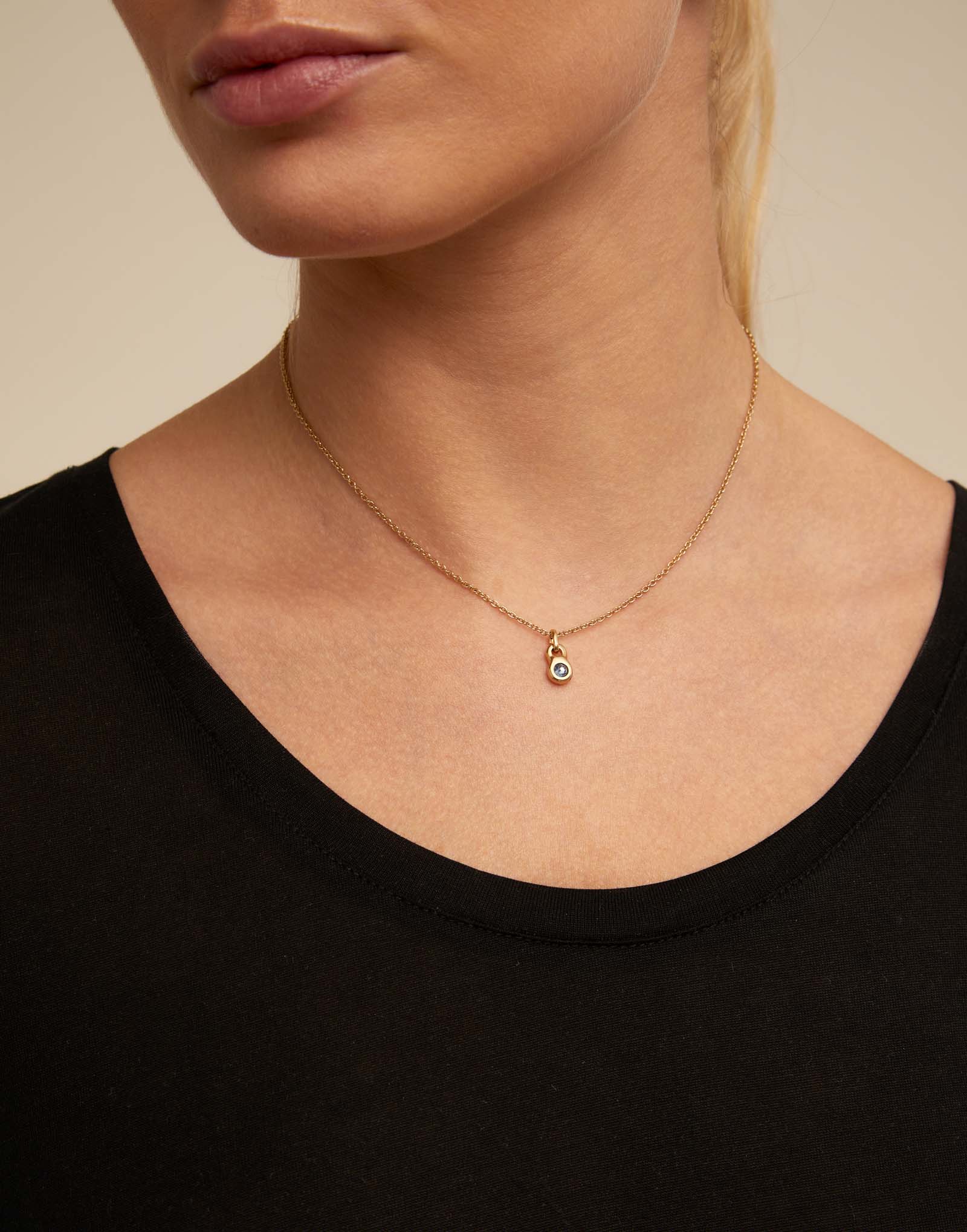 Round shaped Charm with a blue crystal, Golden, large thumbnail