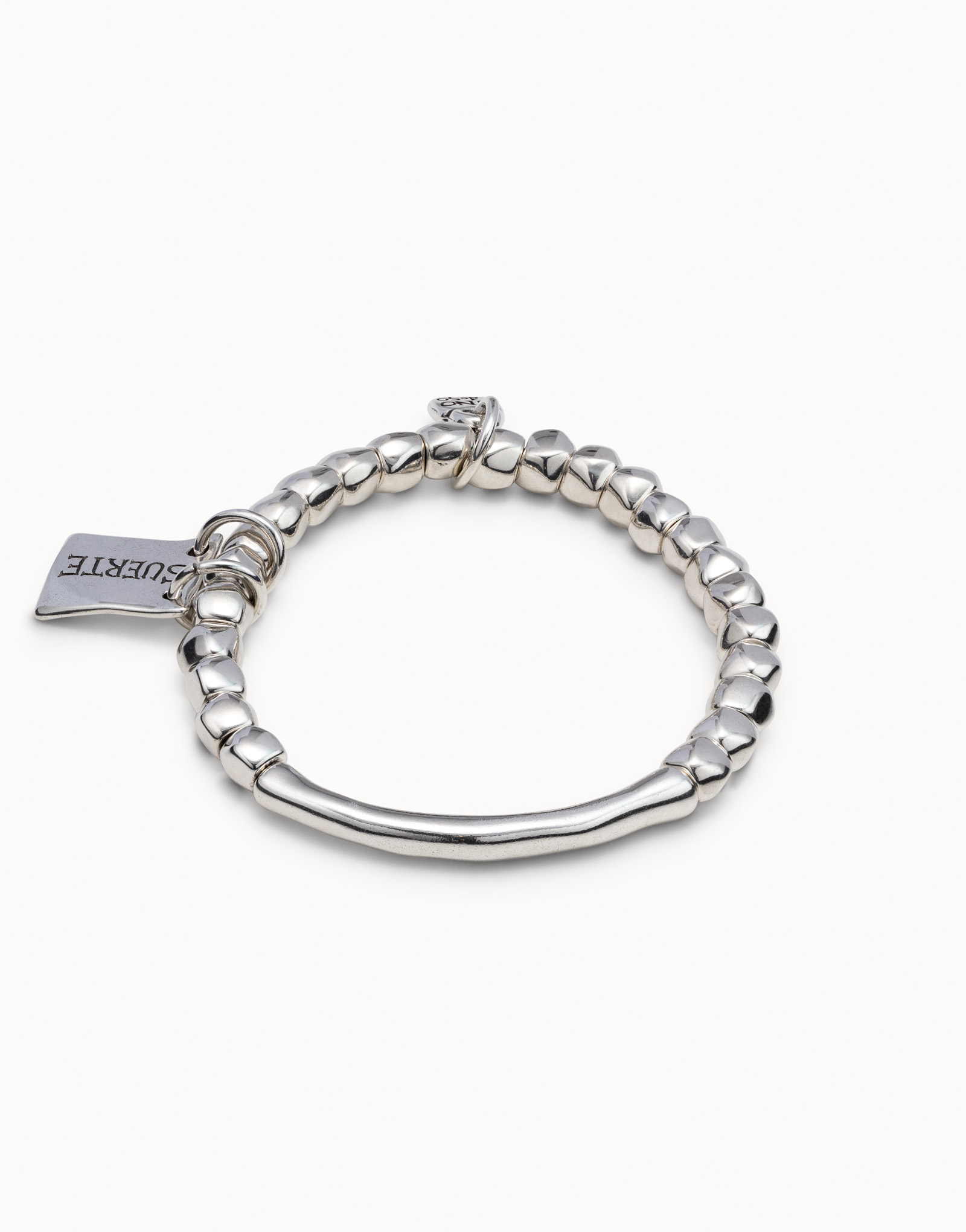 Beaded stretch bracelet with tubular piece and a charm, , large thumbnail